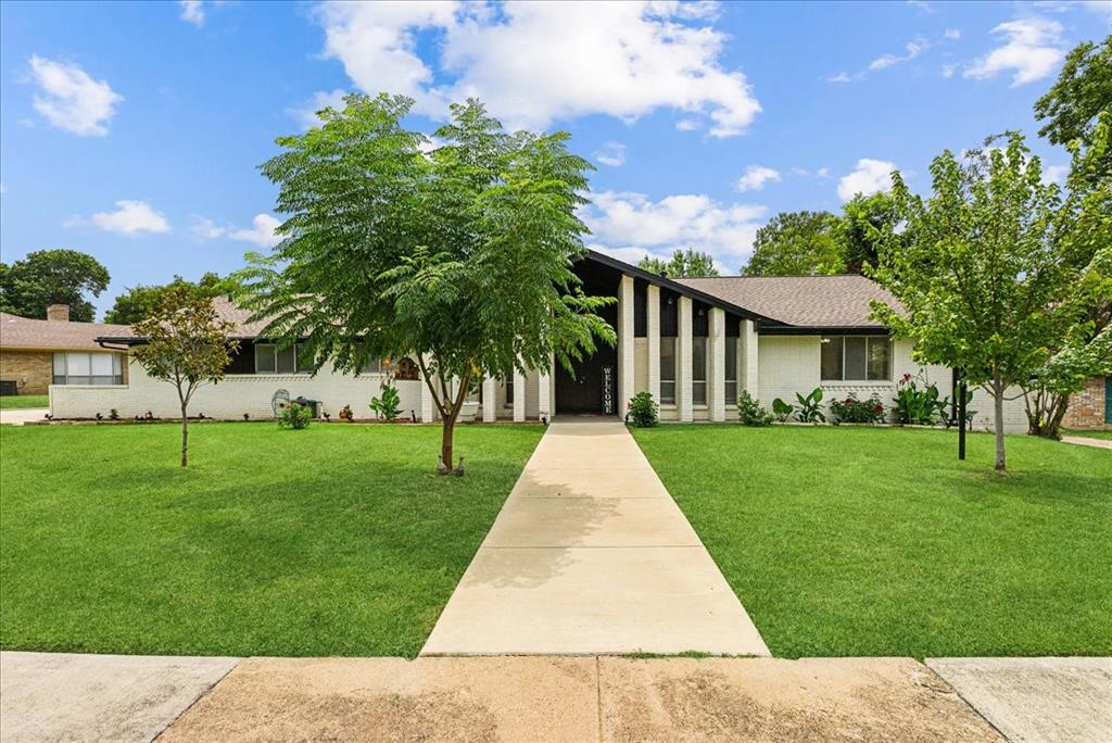 front view of a house with a yard