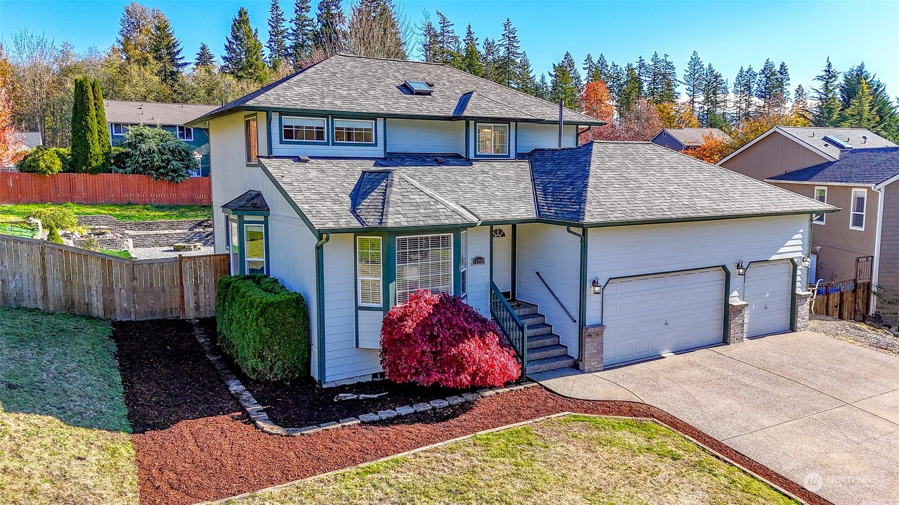 a front view of a house with garden