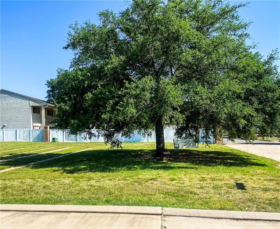 a view of a swimming pool with a yard