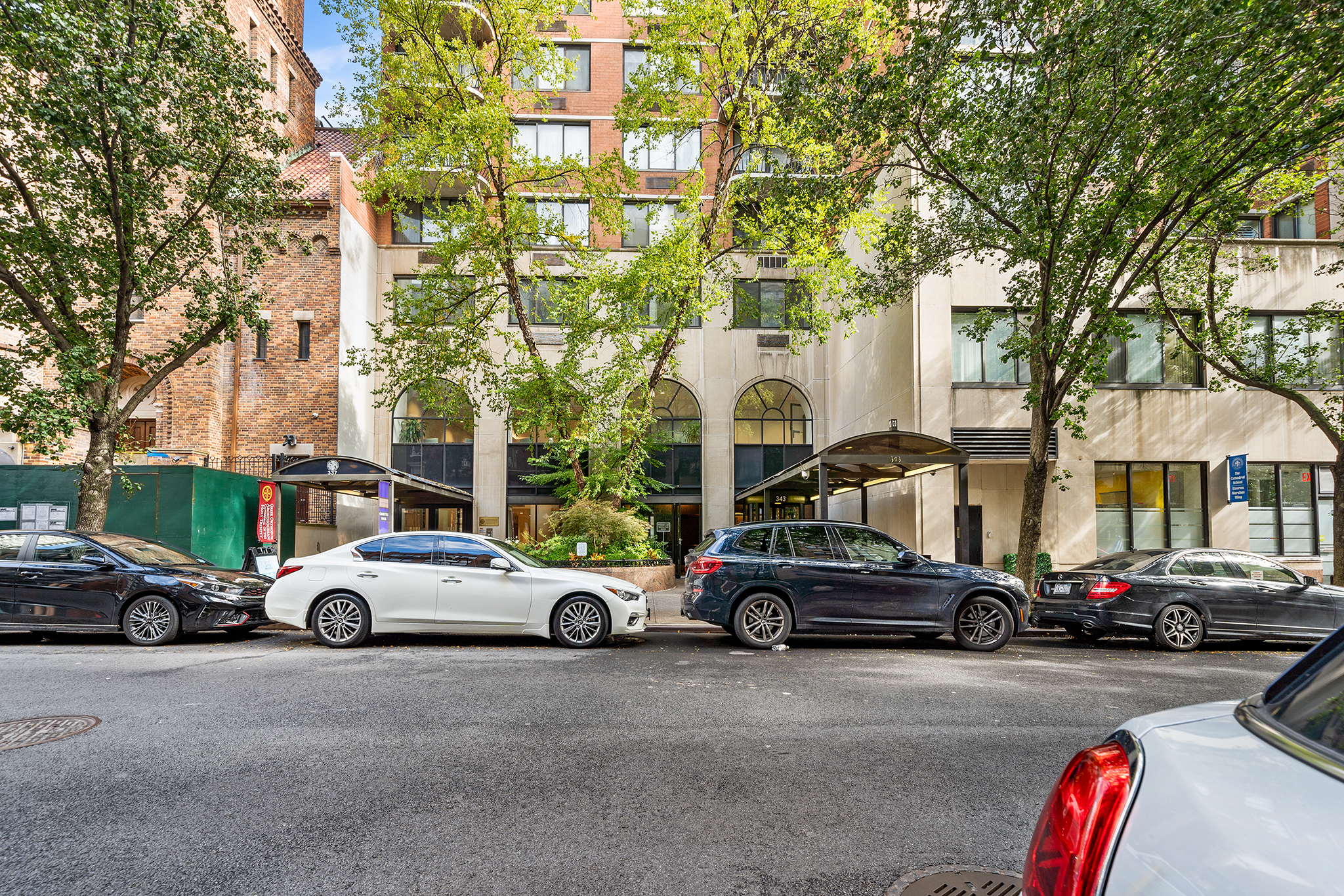 a view of cars parked in front of a house