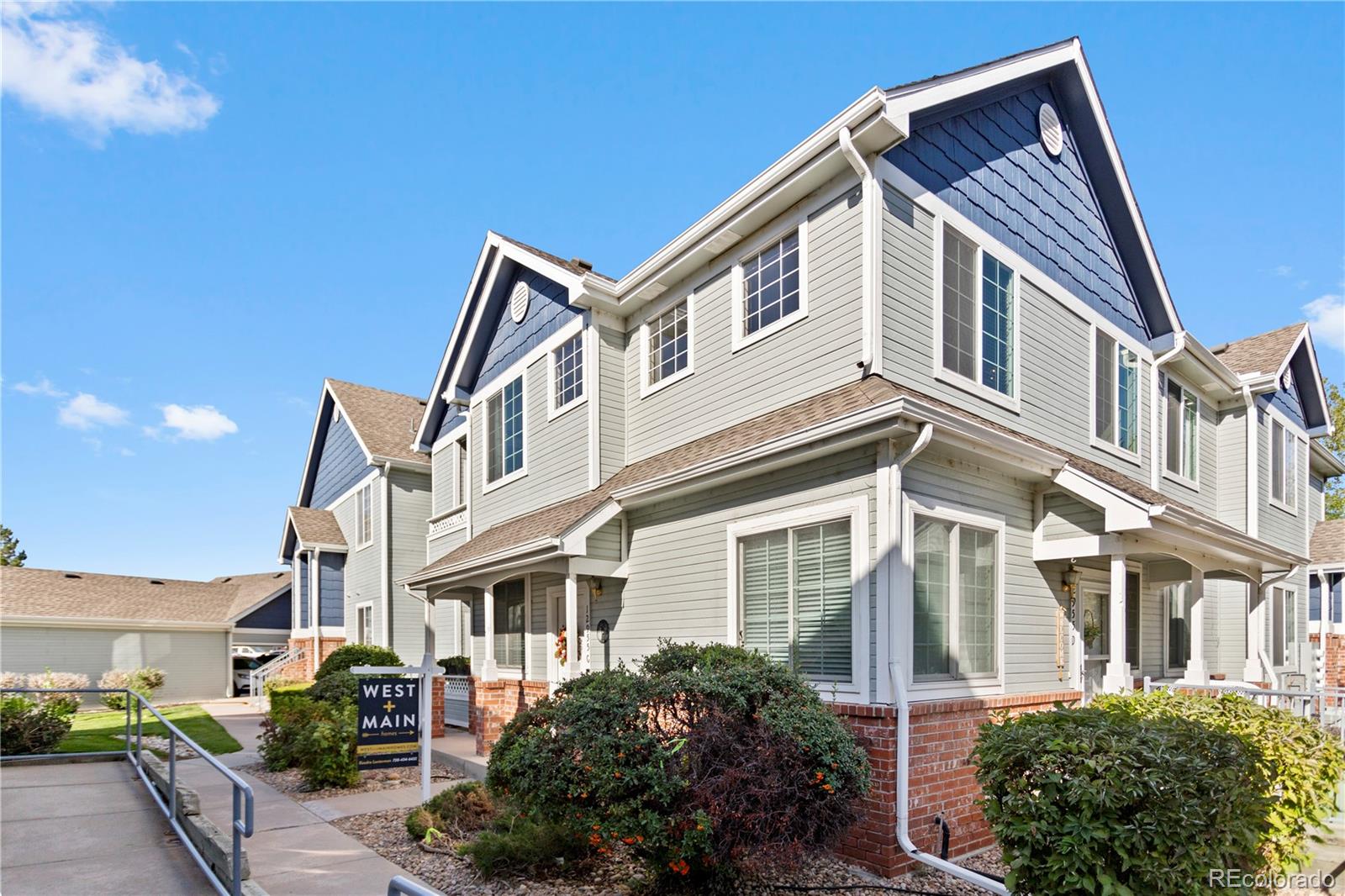 a front view of a house with parking