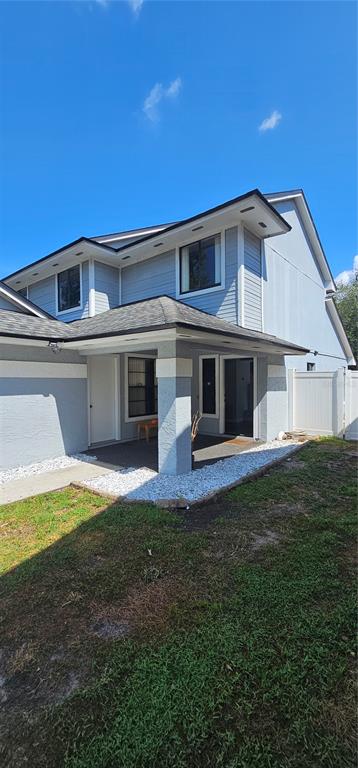 a view of a house with a backyard space