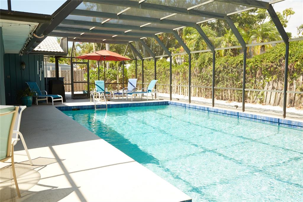 a view of swimming pool with a patio