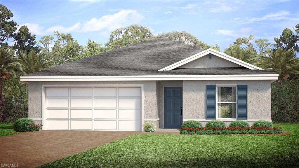 View of front of house with a front yard and a garage