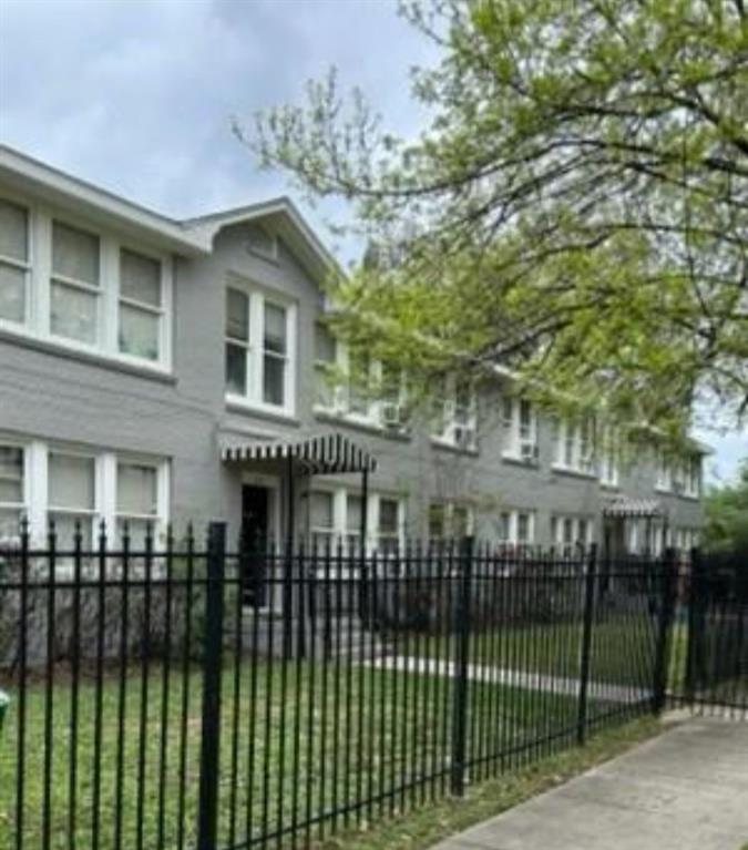 a view of a house with a iron gate