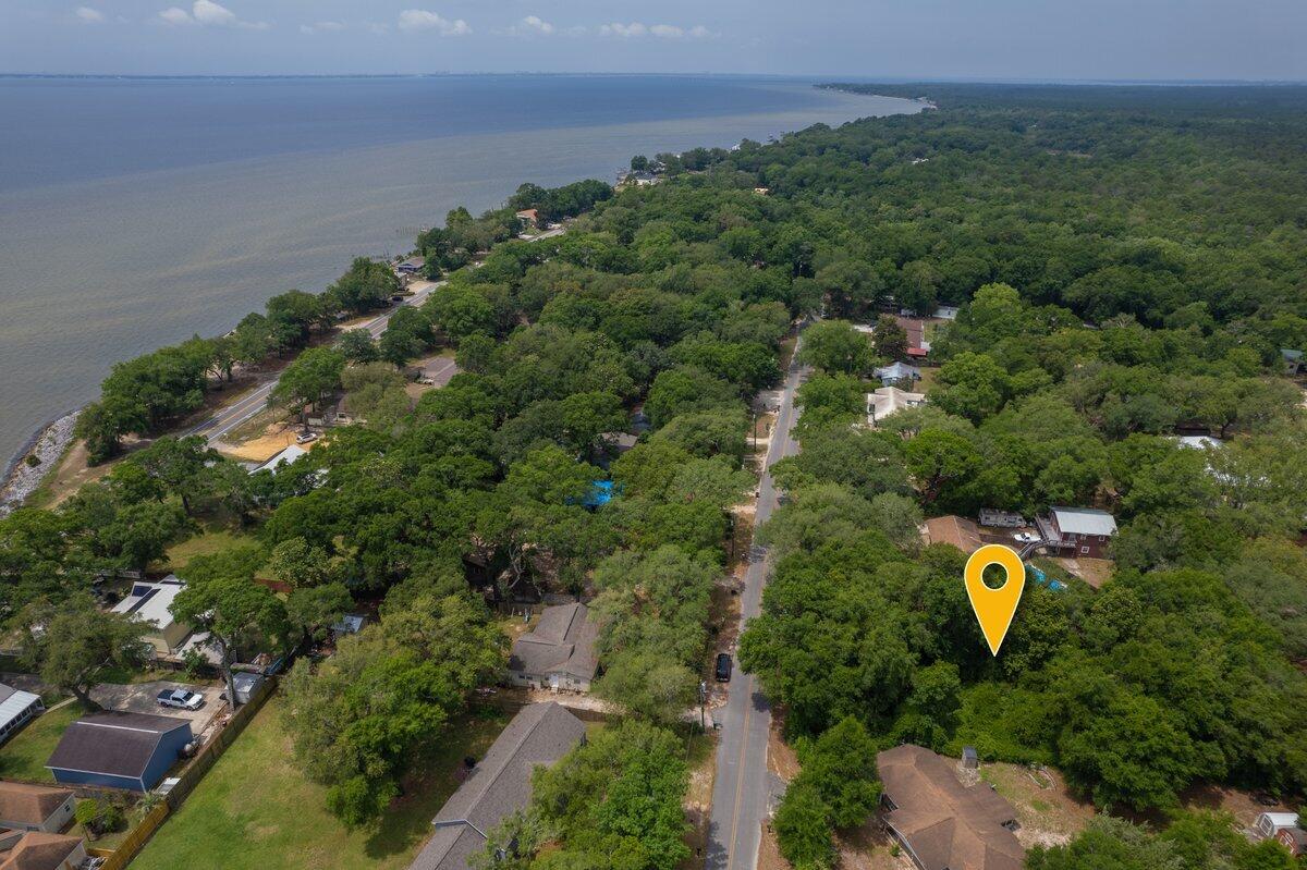 a aerial view of a house with a backyard