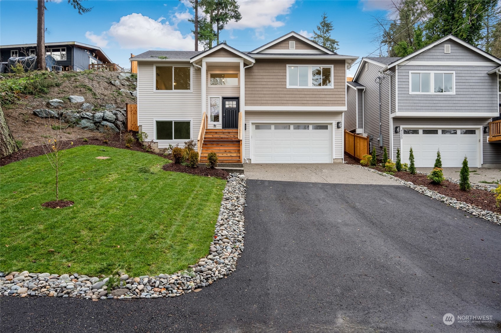 a view of a yard in front view of a house