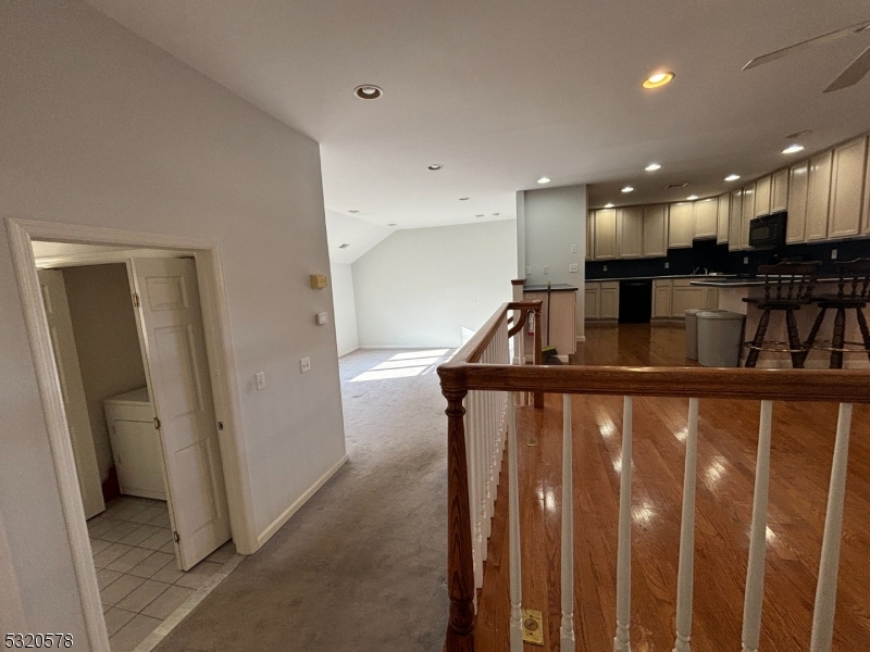 a view of a living room with stairs