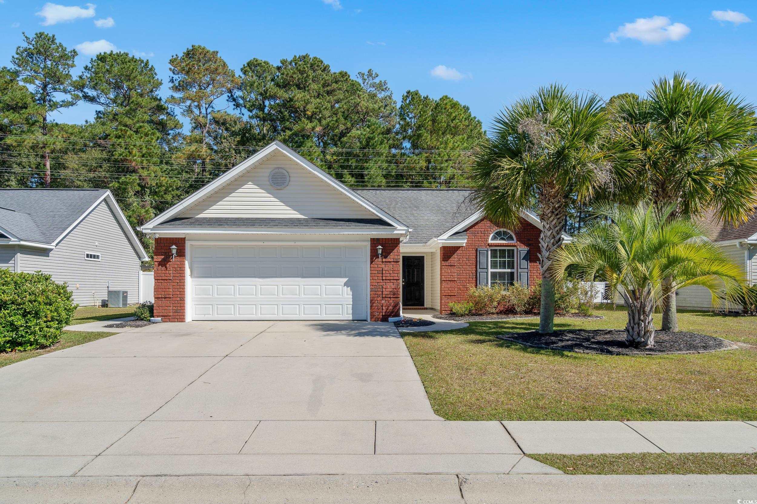 View of front of property with a front yard and a