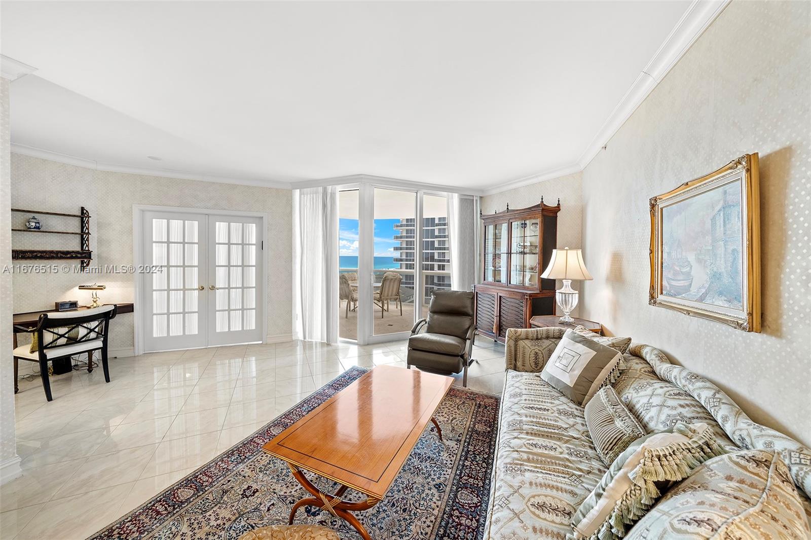 a living room with furniture large window and table