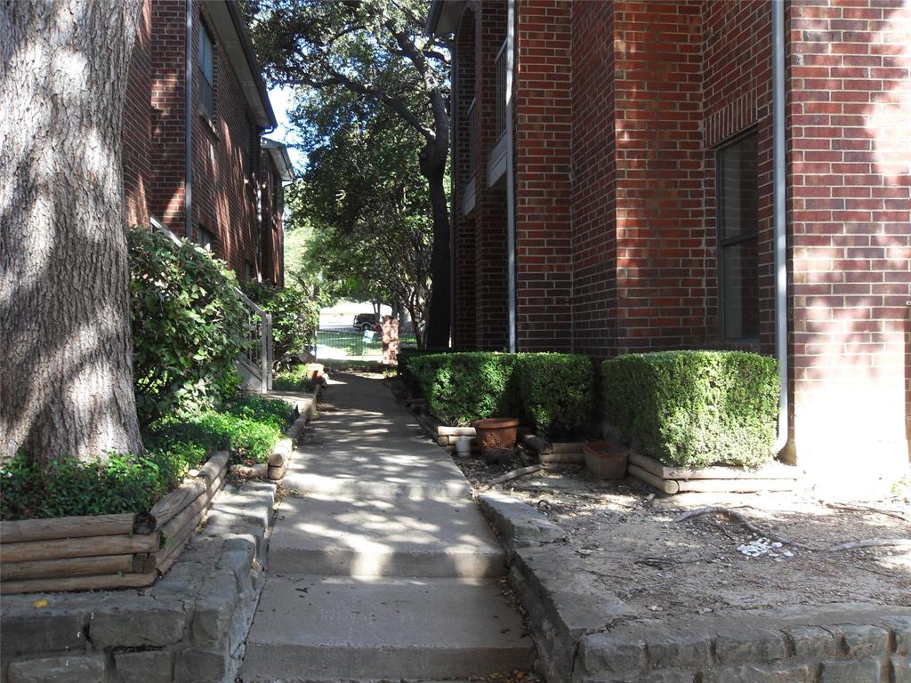 a view of a pathway both side of building