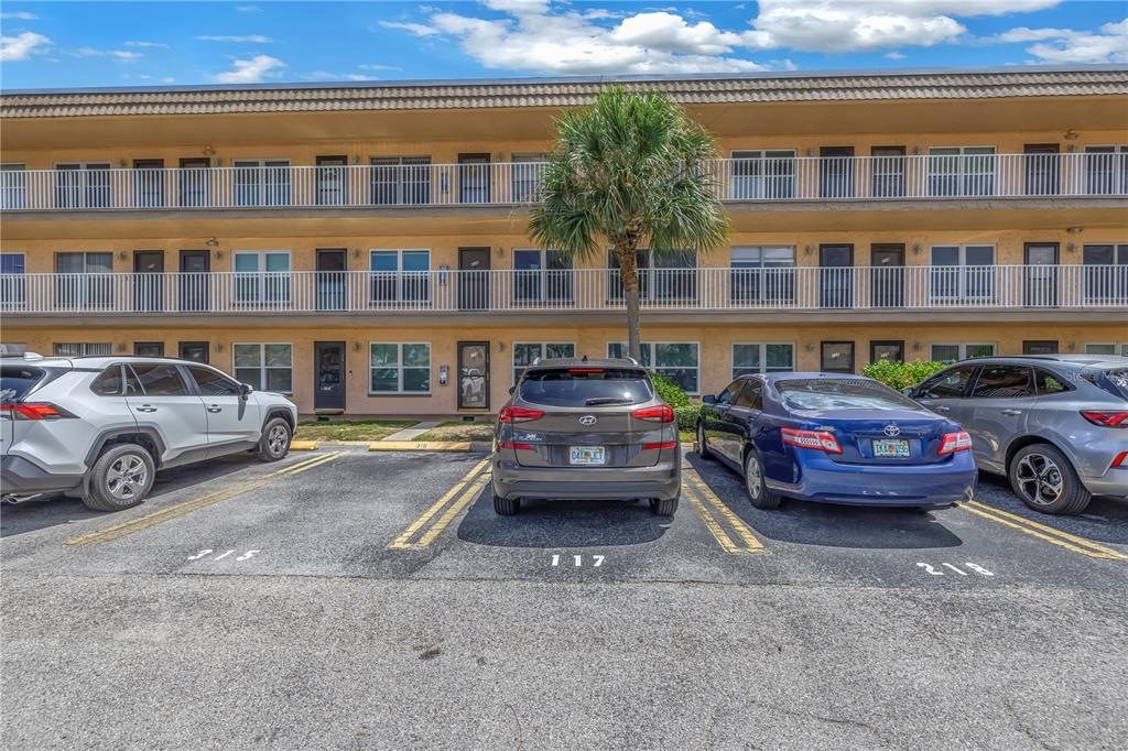 a view of cars parked in front of a building