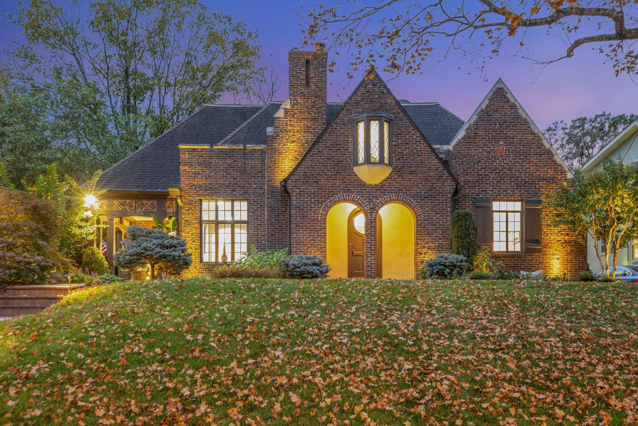 a front view of house with yard and green space