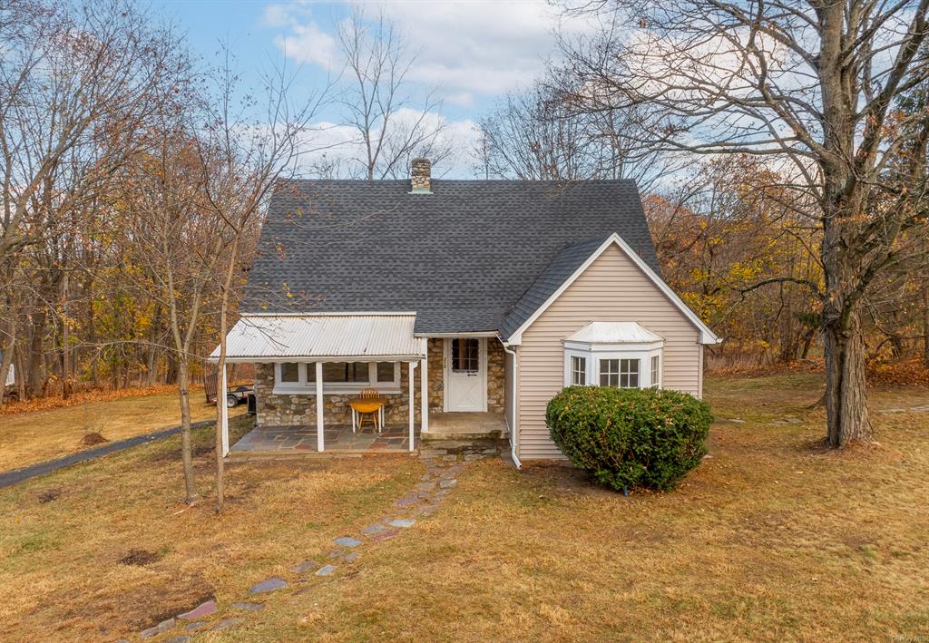 View of front of home featuring a patio area and a front lawn