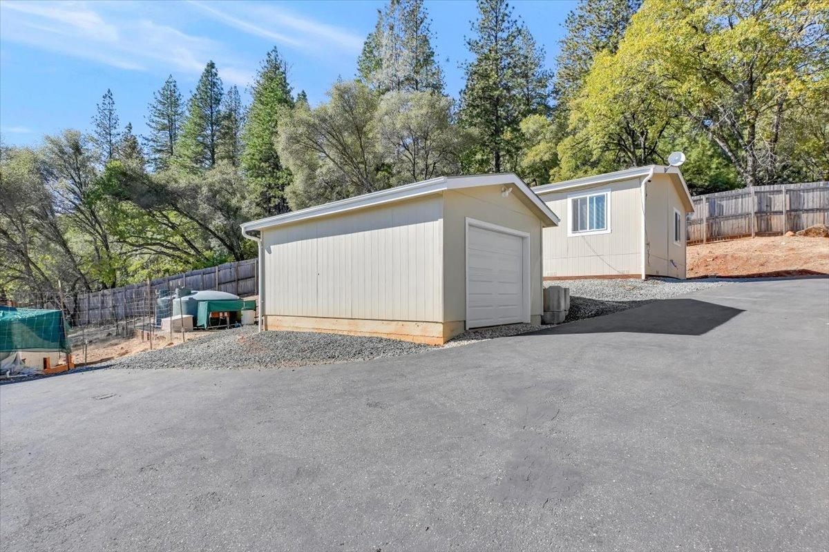 a view of a house with a yard and garage