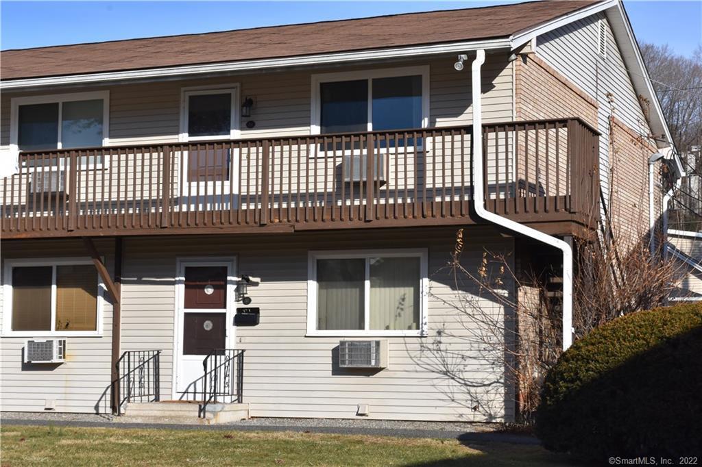 a view of a house with wooden deck