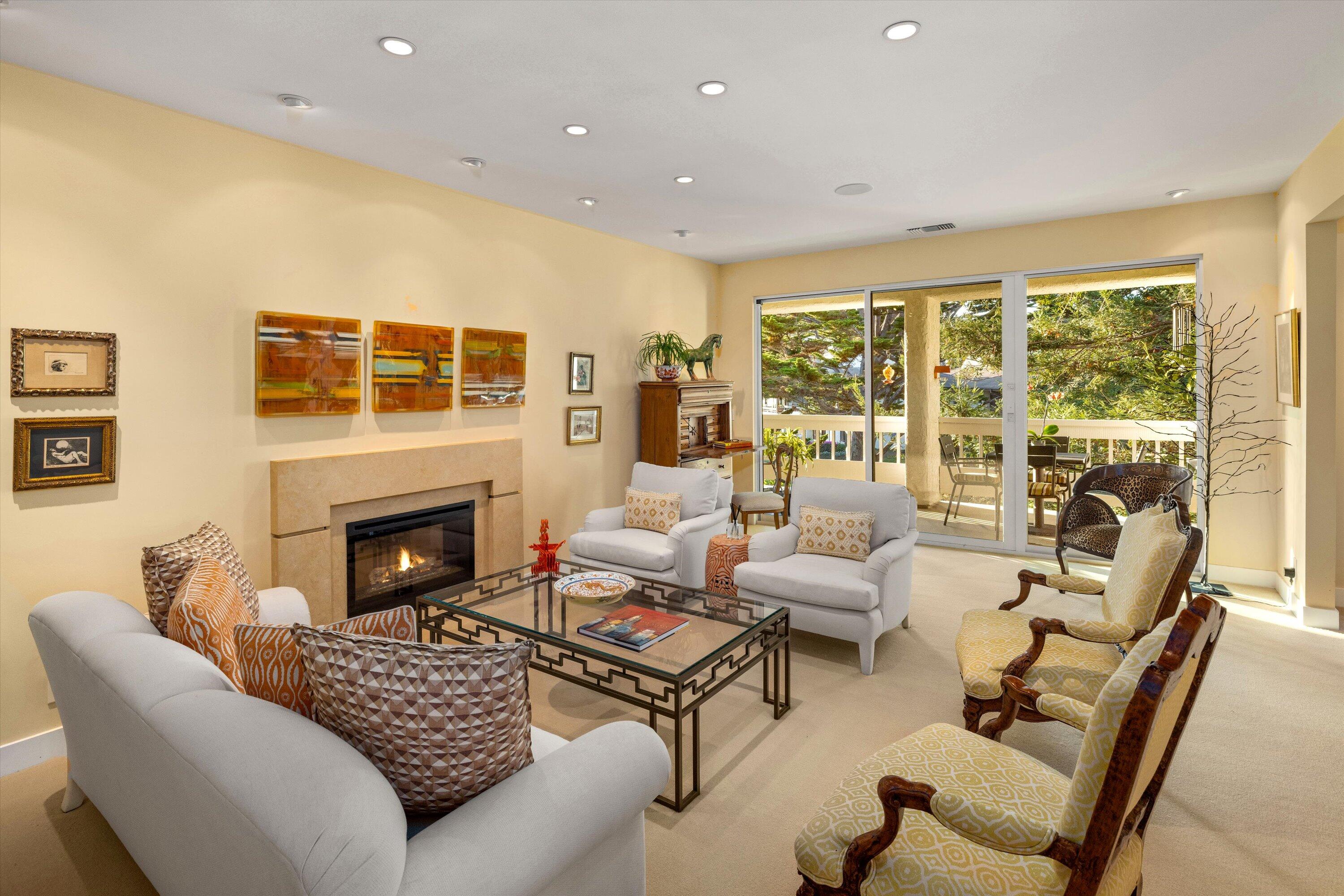 a living room with furniture or fireplace and a table