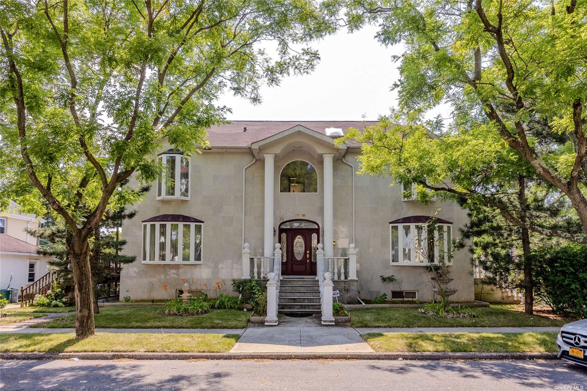 a front view of a house with garden