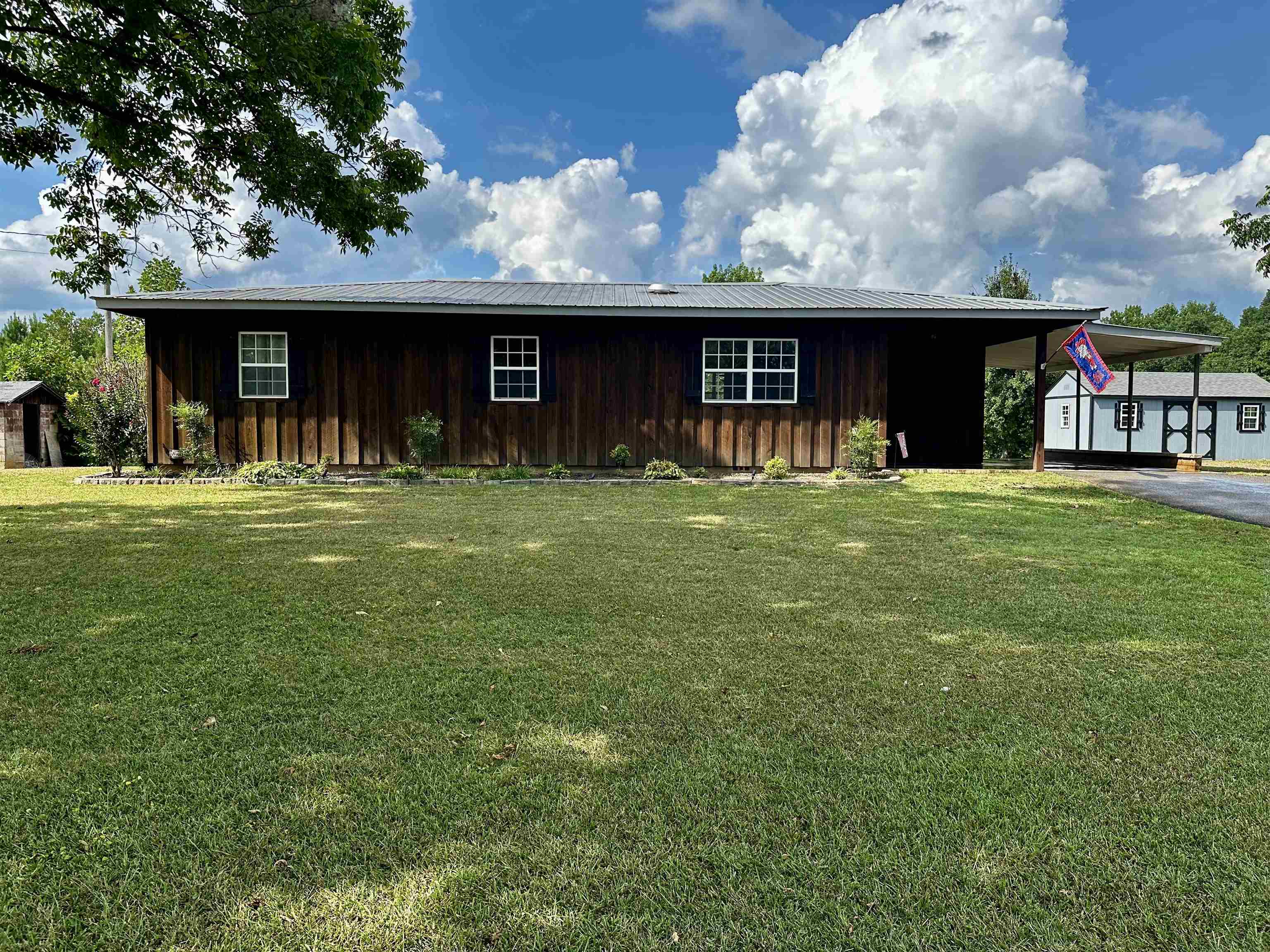 a front view of a house with a yard