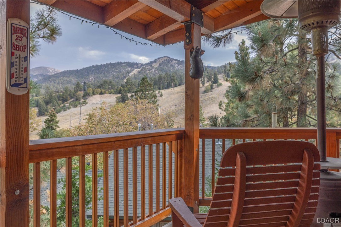 a view of a balcony with a tree