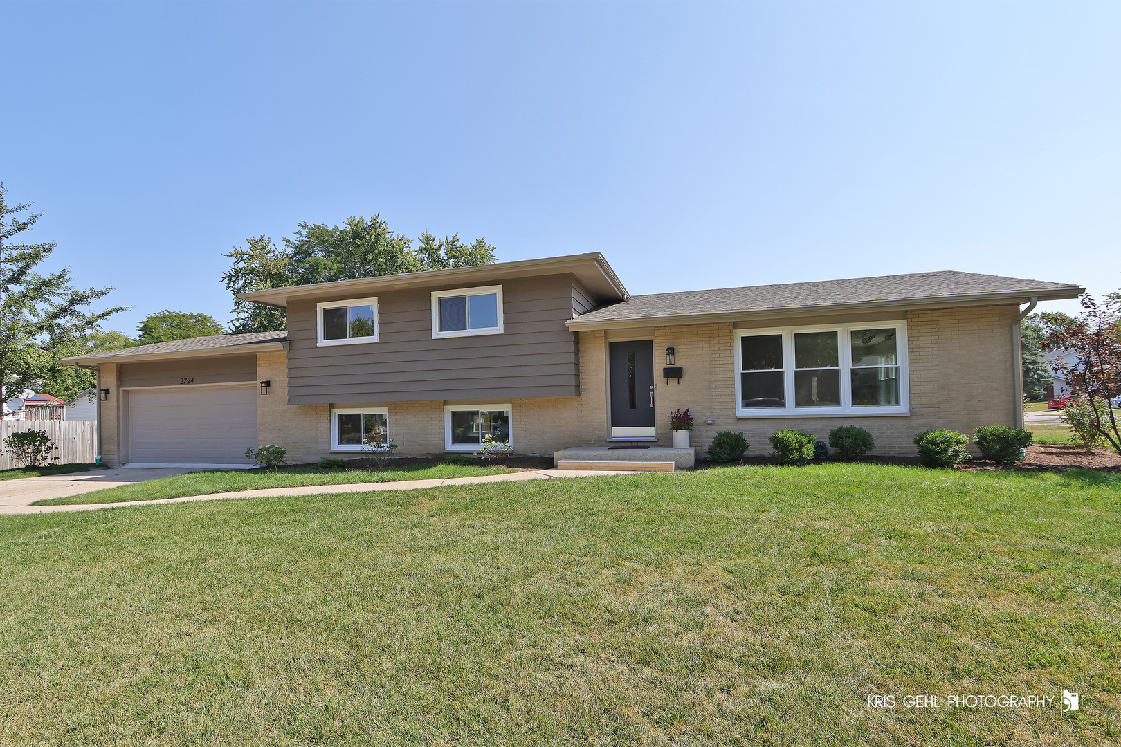 front view of a house with a yard