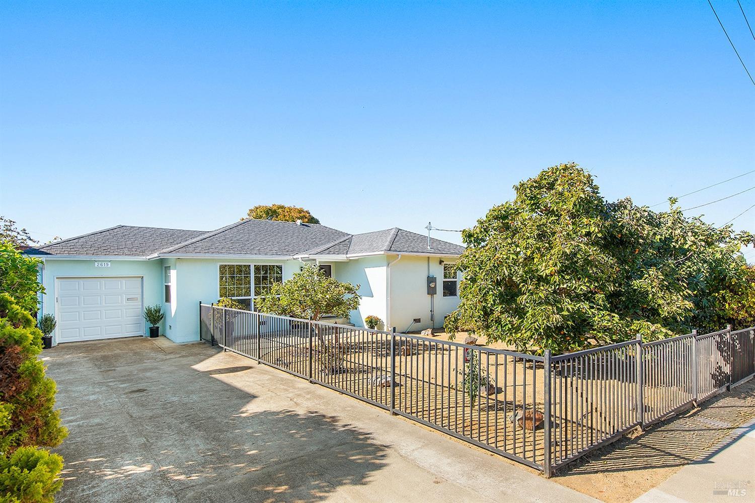 a view of a house with a yard