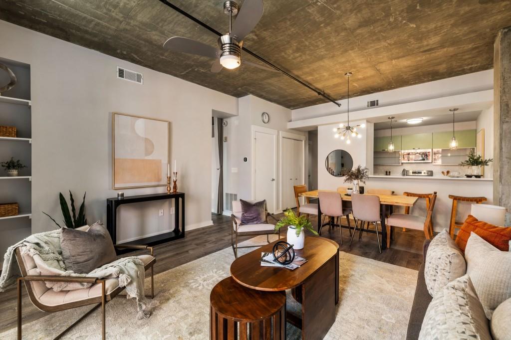 a living room with furniture and wooden floor