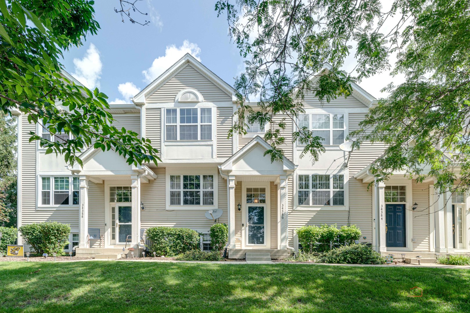 front view of a house with a yard