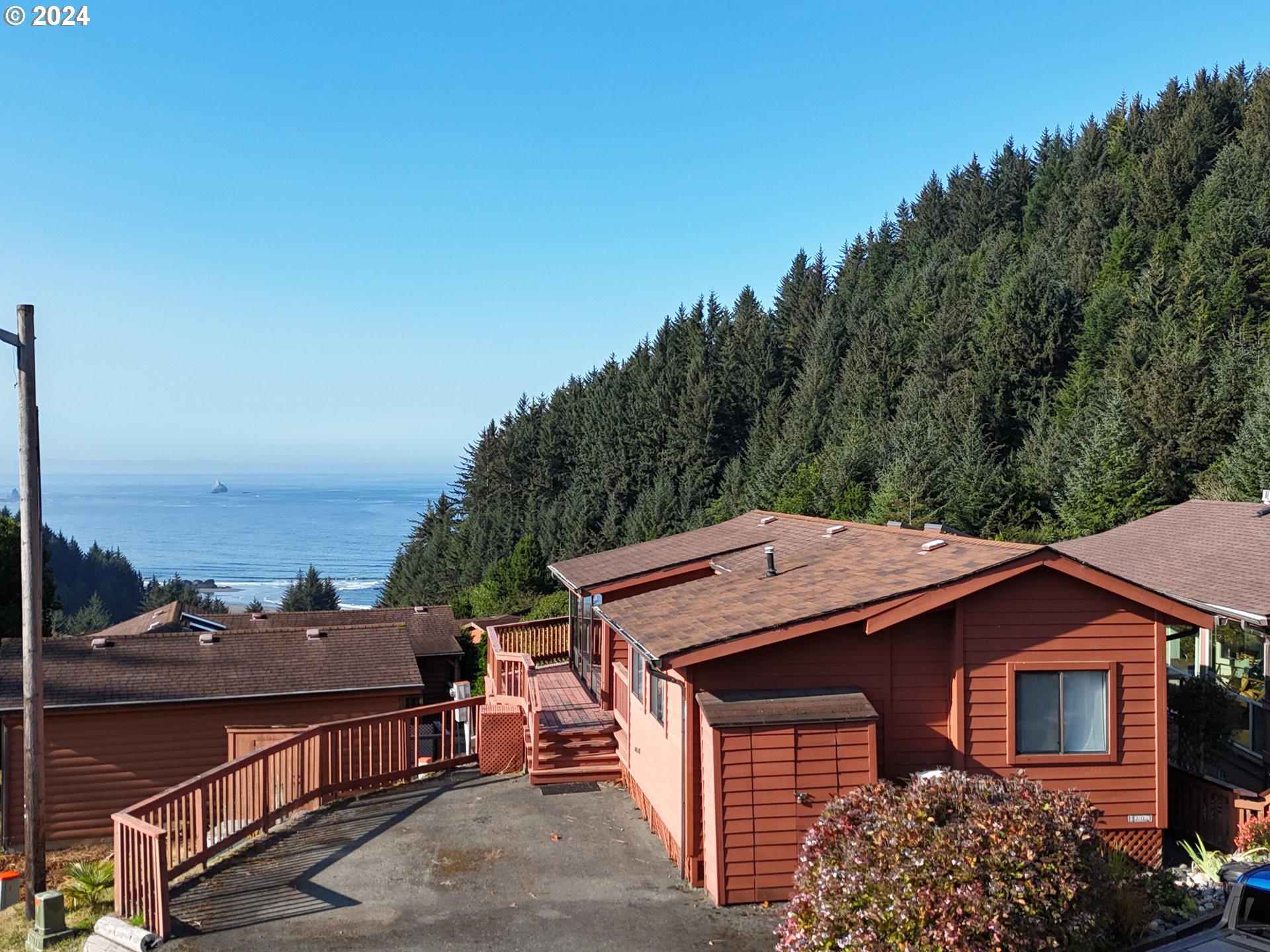 a aerial view of a house with a yard