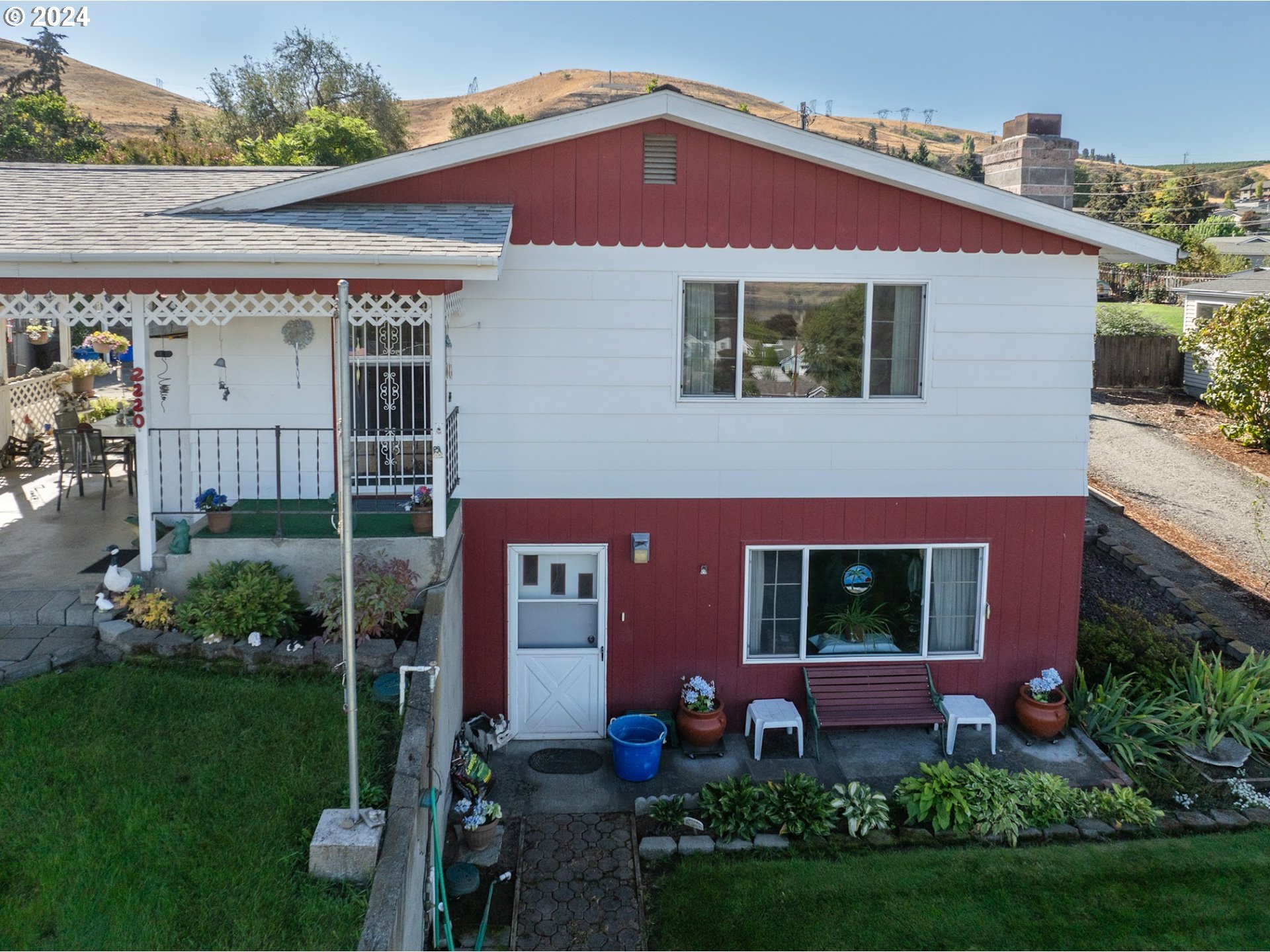 a front view of a house with garden