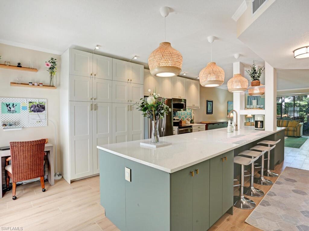 a kitchen with cabinets a sink and a stove