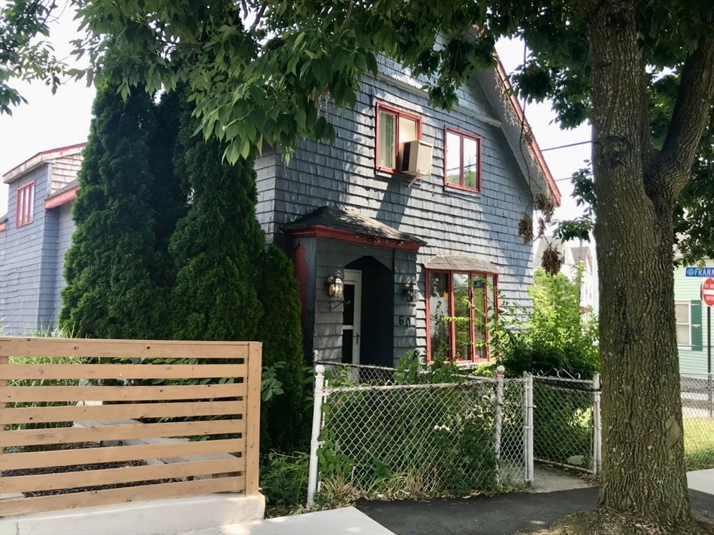 front view of a house with a garden