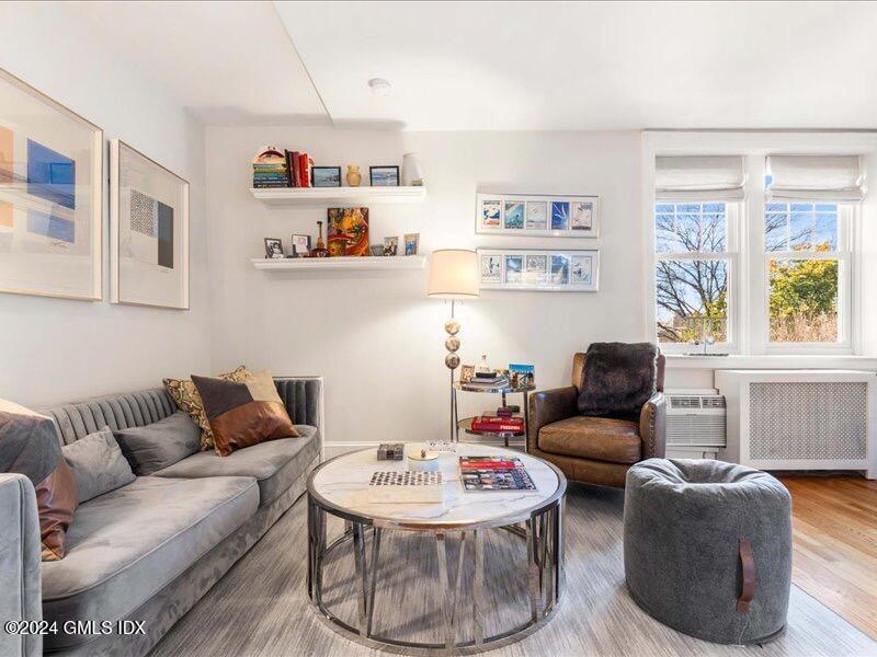 a living room with furniture and a window