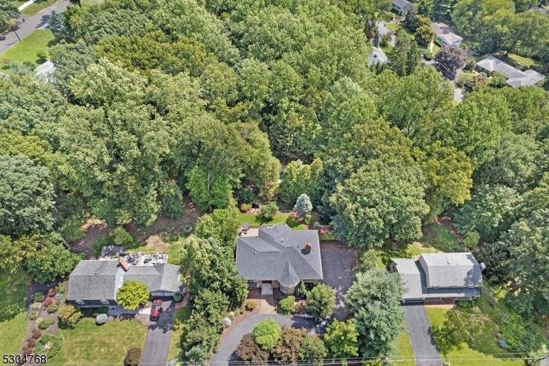 an aerial view of house with yard