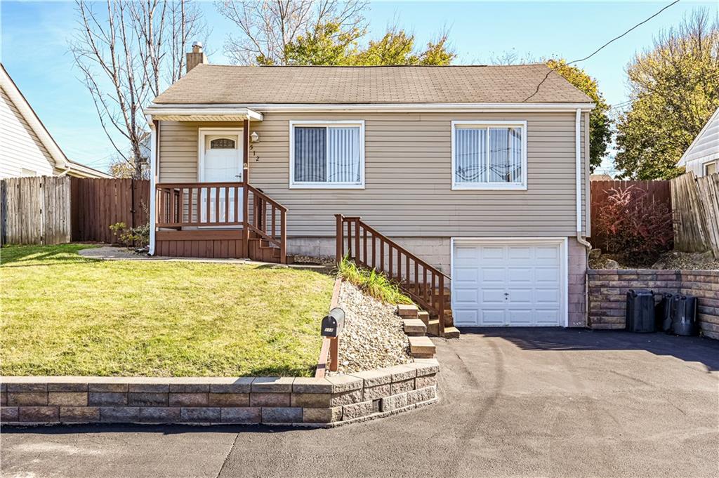 a view of a house with a wooden deck