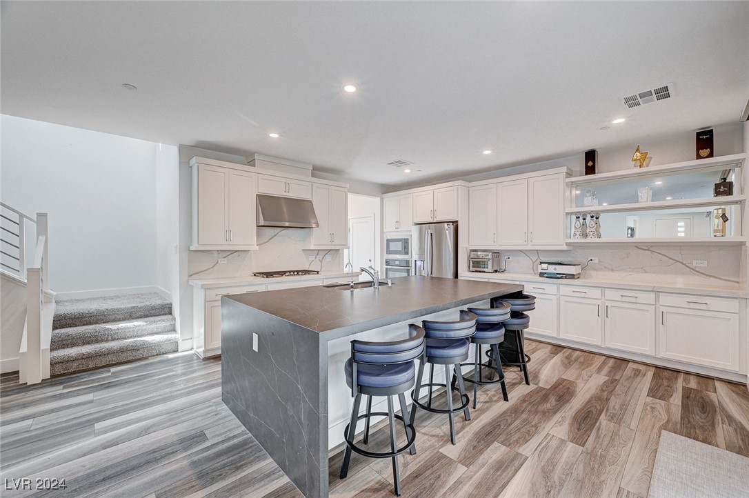 Upgraded kitchen with leathered granite waterfall