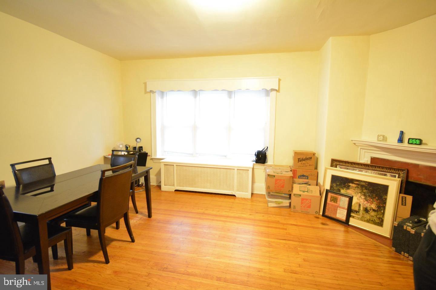 a view of a dining room with furniture and a table