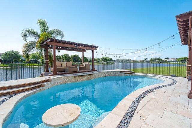 swimming pool view with a outdoor seating