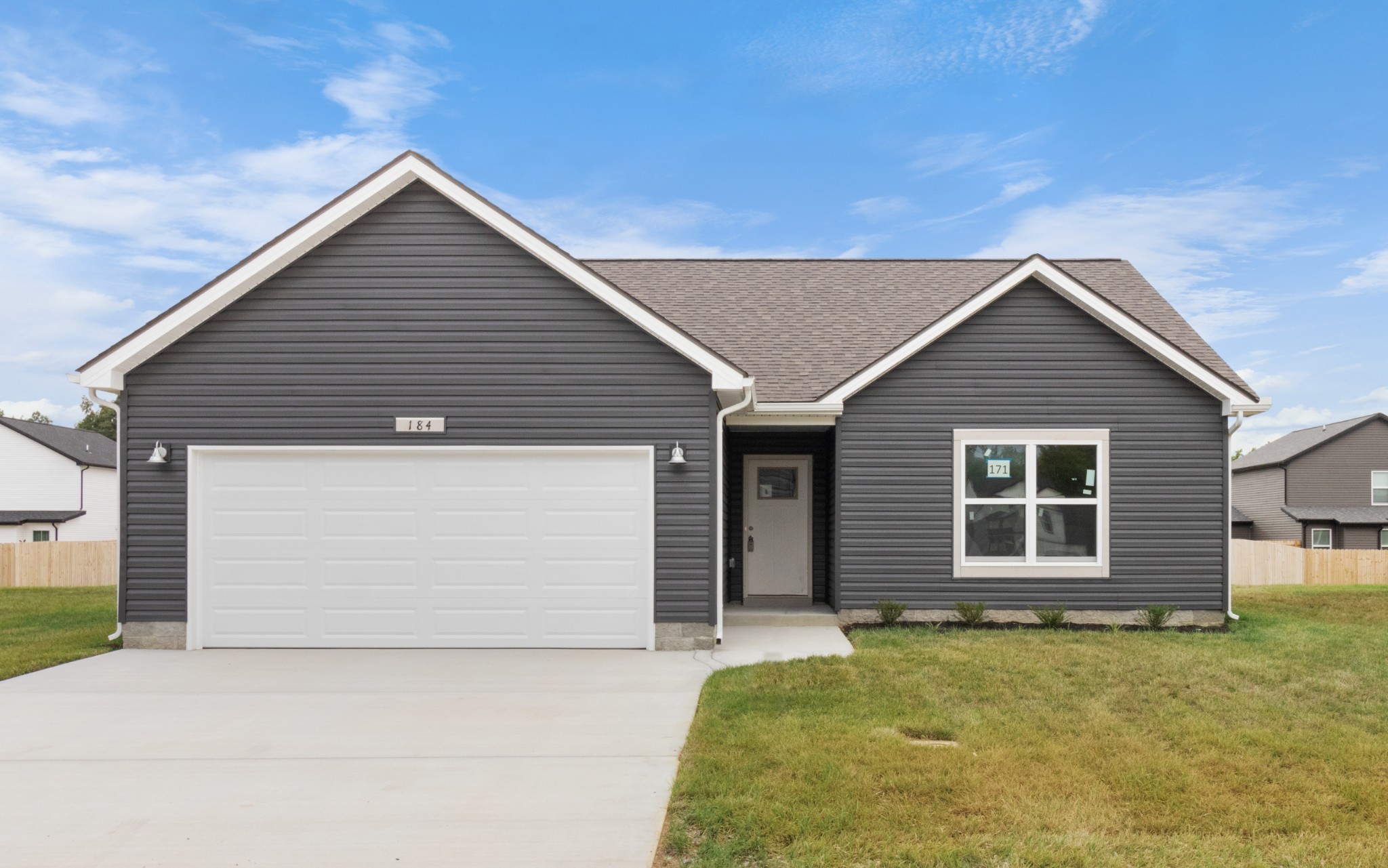 a front view of the house with garage