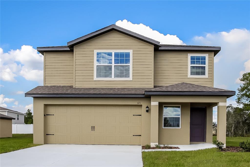 a front view of a house with a yard