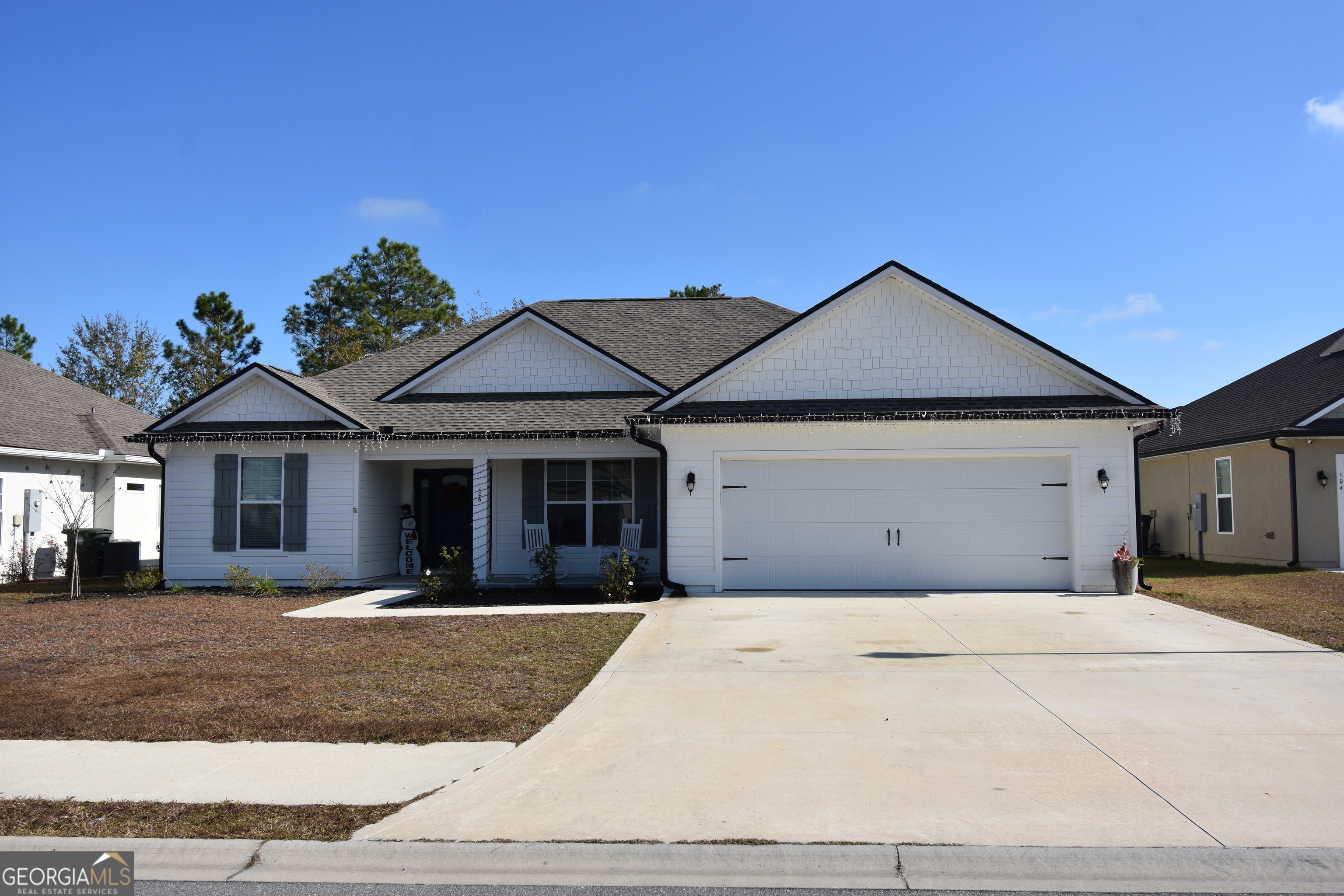 a front view of a house with yard