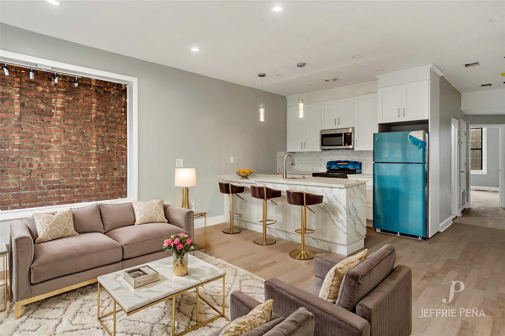 Living room featuring sink and light hardwood / wood-style floors