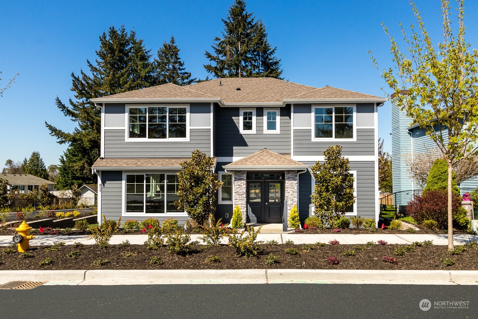 a front view of a house with a yard