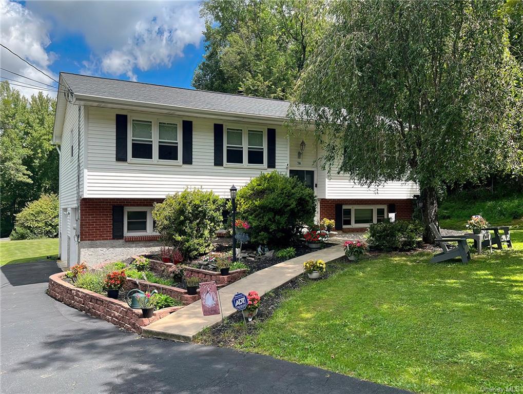 Bi-level home with a front yard