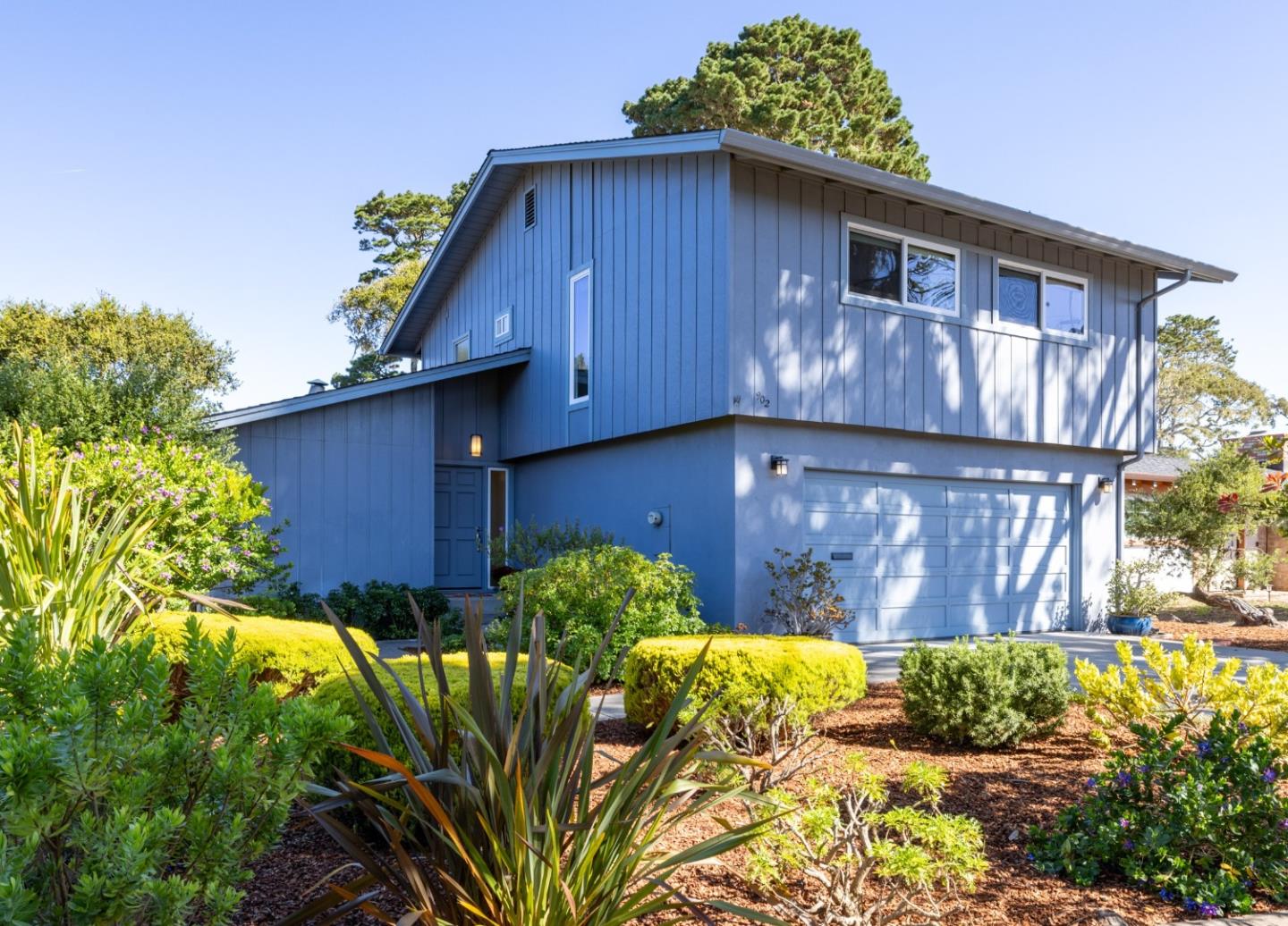 a view of a house with wooden fence