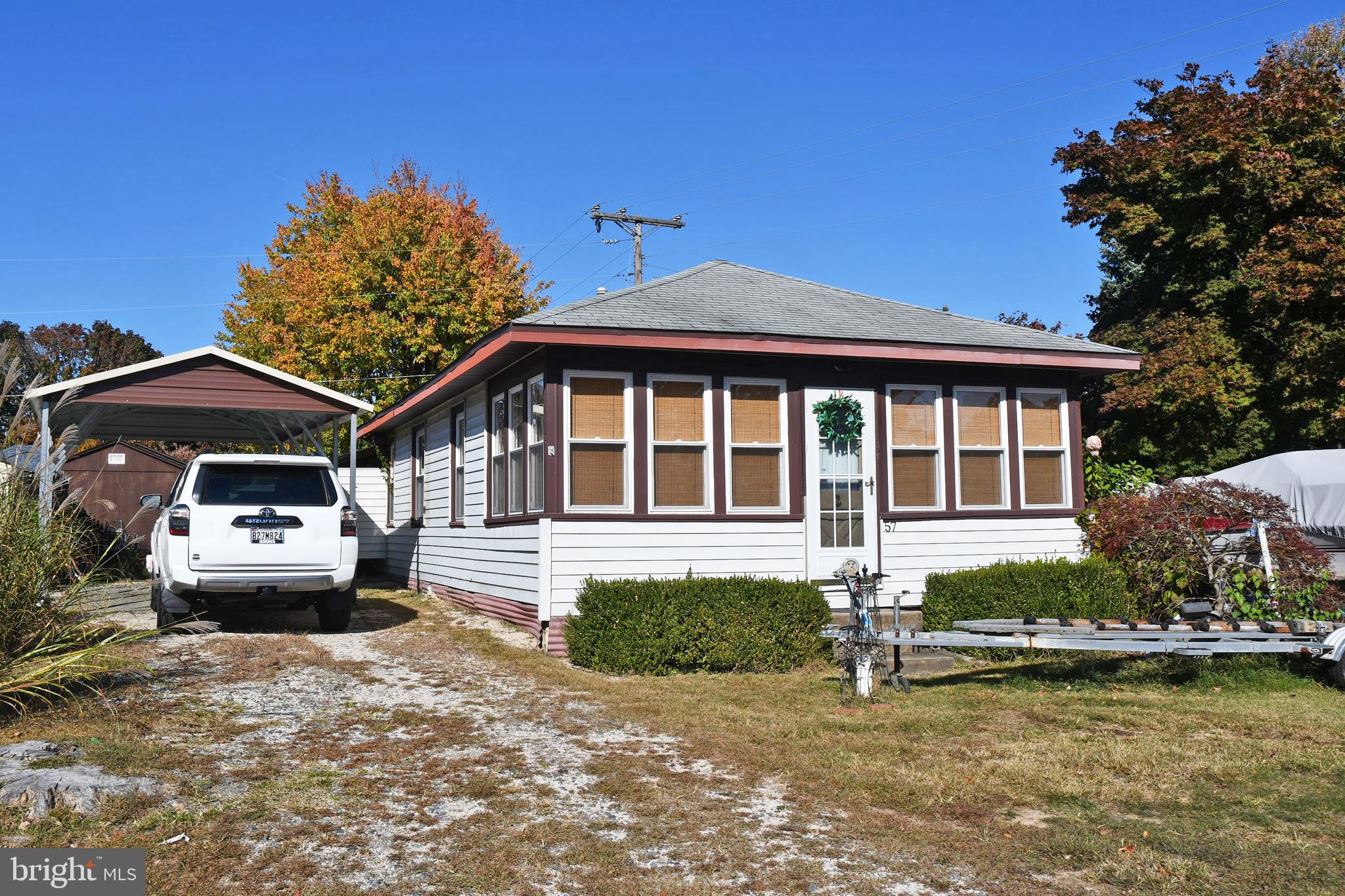 a front view of a house with yard and garage