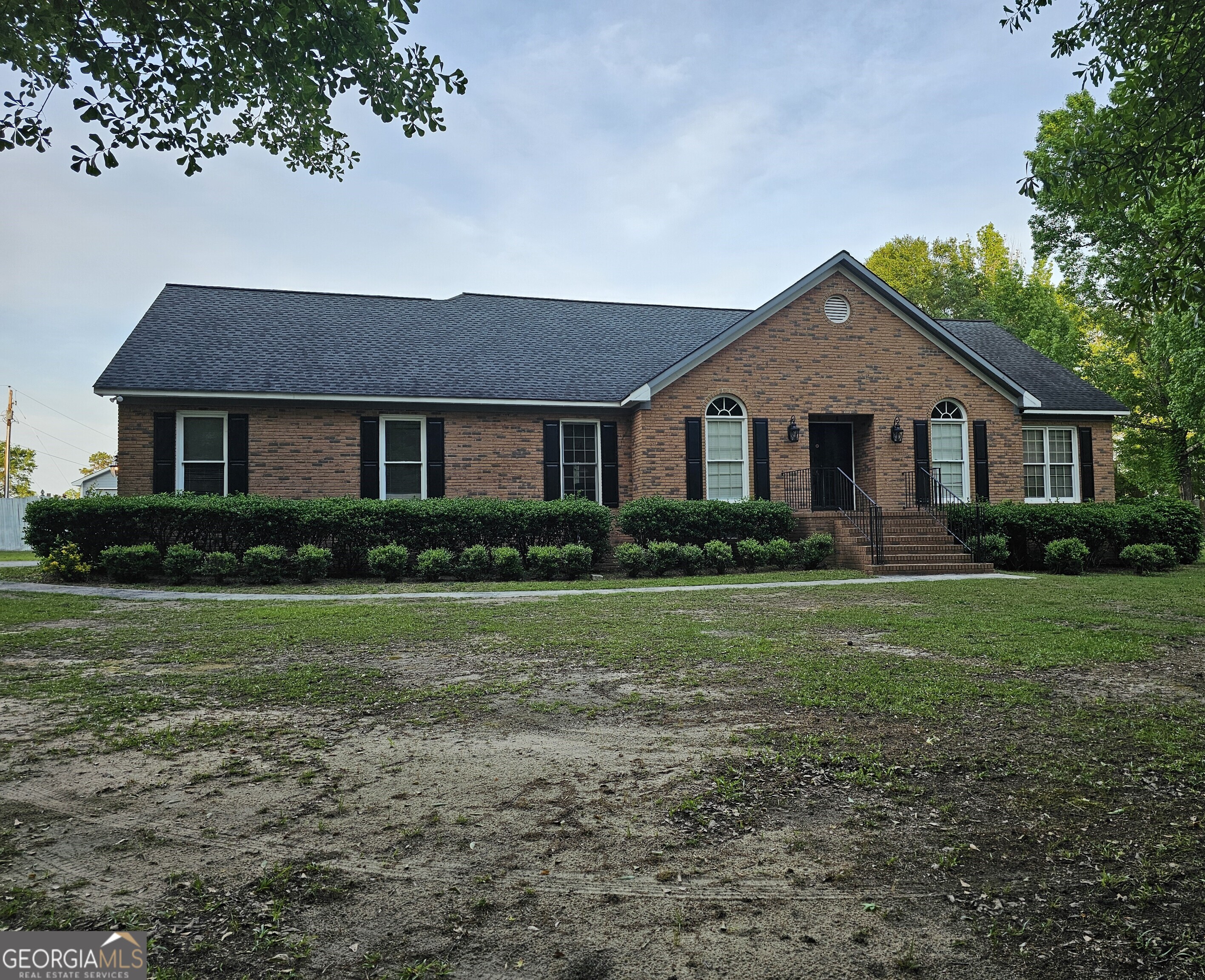 a front view of a house with a yard