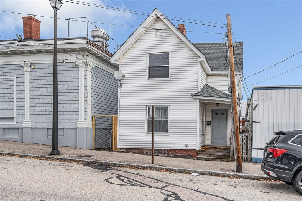 a view of a house with a street