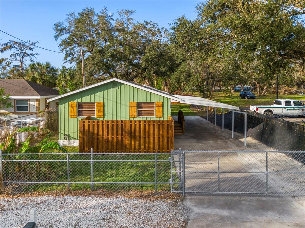 a view of backyard with green space