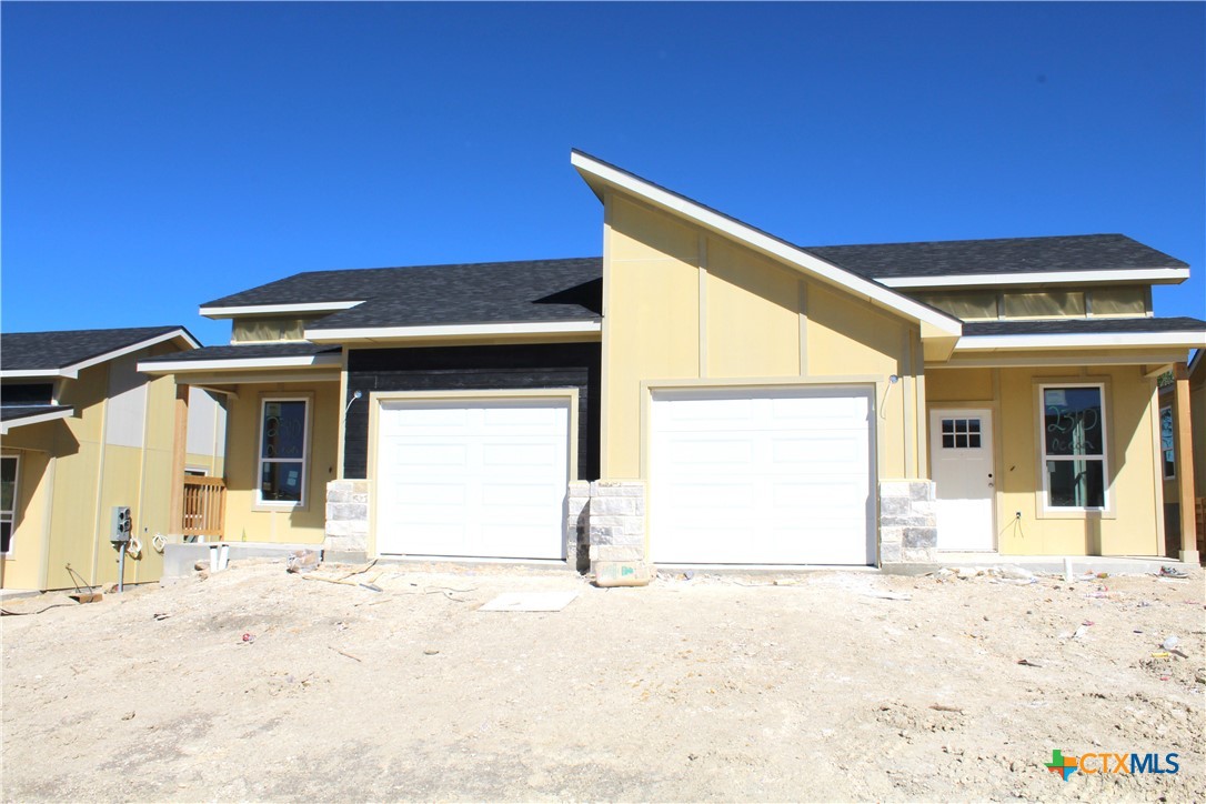 a front view of a house with a outdoor space